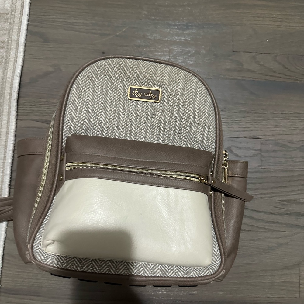 Brown and Cream Backpack with Gold Accents